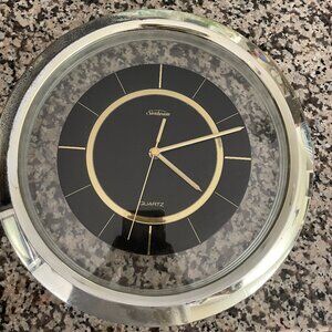 Fully functioning gold rimmed clock.